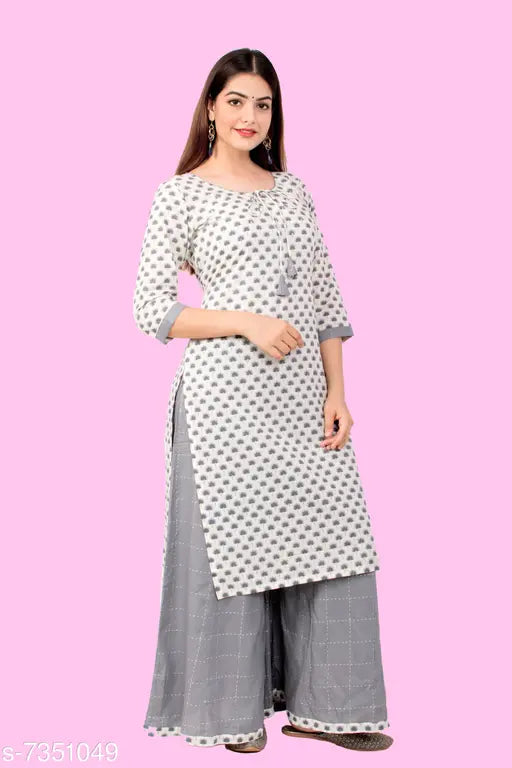 Women's cotton A-line printed long kurti with palazzos - single set in sizes S, M, L, XL. Vibrant Indian fashion for women, featuring three-quarter sleeves and a print design
