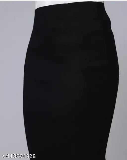 Black polycotton pencil skirt for women, versatile semi-formal office wear or party outfit. Knee-length, elasticated waist belt, machine washable