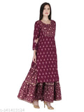 Rayon gold-printed wine-colored kurta set with sharara, featuring three-quarter sleeves and lacework on yoke and sharara. Indian women's fashion accessory