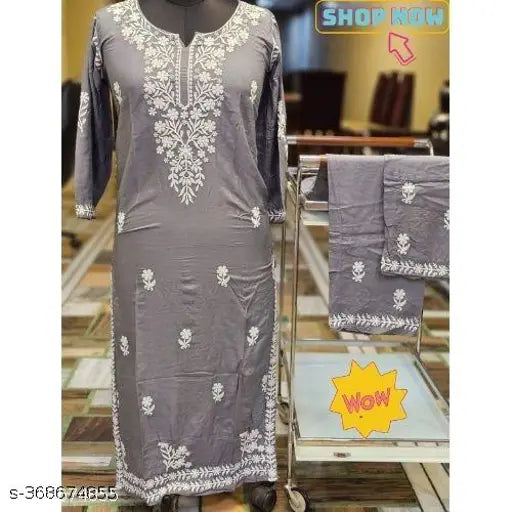 Rayon Chikankari kurta set with printed net bottomwear, three-quarter sleeves, Indian fashion on display