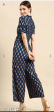 Navy blue rayon printed jumpsuit with short sleeves, featuring sizes XXS to XXL. Model wears size M on display