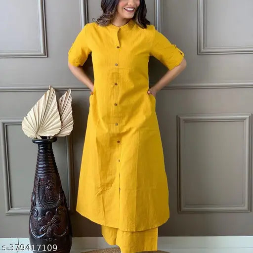 yellow cotton kurta plazo set with pockets, solid design, three-quarter sleeves, Indian ethnic wear for women