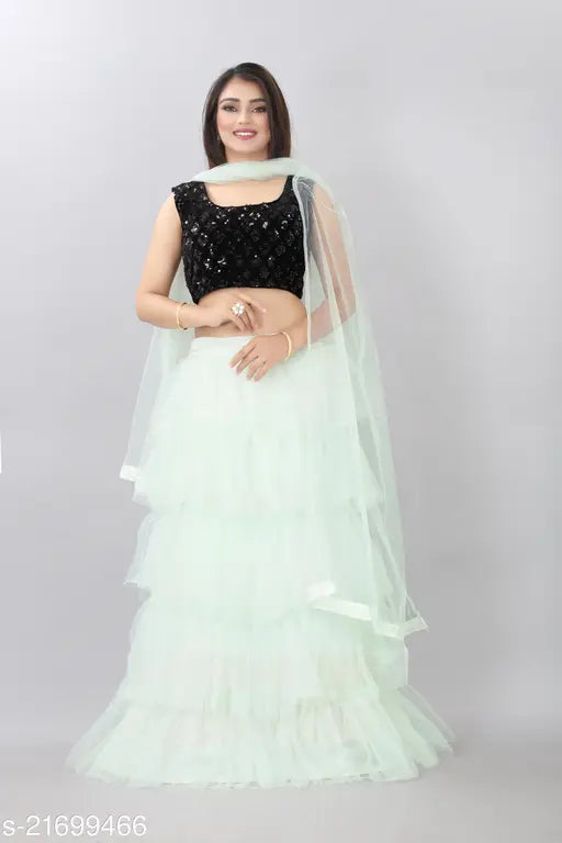 Light green semi-stitched lehenga with sequins and dupatta, velvet choli, embroidered motifs, lace dupatta. Indian ethnic wear on display