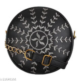 Black faux leather embroidery sling bag with one compartment, free size. Embroidered bag on a flat surface