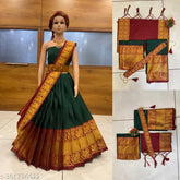 Traditional South Indian Kids Half Saree set in Litchi Silk, unstitched with zari work and free size (2.3m dupatta). Art silk lehenga, choli, and dupatta on display