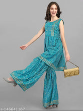 Women's bandhani cotton kurta sets, vibrant Indian ethnic wear for L (Bust 40in, Top & Bottom Length 40in, Waist 30in, Hip 46in, Length 39in) and XL (Bust 42in, Top & Bottom Length 40in, Waist 32in, Hip 48in, Length 39in), handcrafted in India