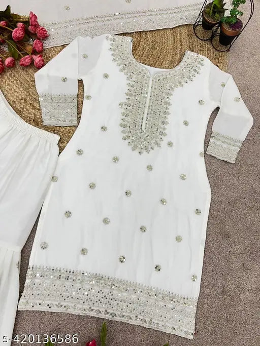 Silk embroidered kurta and dupatta set with plazzo bottomwear, trendy Indian fashion on mannequin