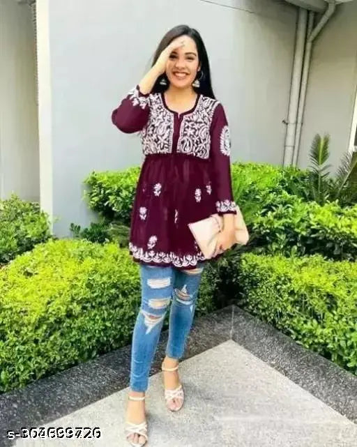 Embroidered Georgette short kurtis in wine tone with three-quarter sleeves, perfect for party or casual wear. Made in India." (108 characters)