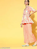 Multi-color digital print flared cotton kurta with palazzo set, featuring a floral peplum top with plunge neck, short sleeves, front slit, and geometrical palazzos. Indian-origin women's fashion