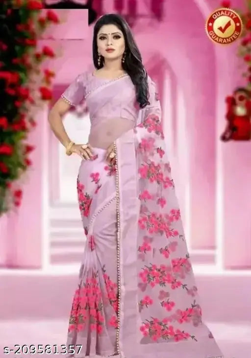 Pink net saree with flower design, embroidered blouse. Traditional Indian fashion for parties and weddings. Net fabric, free delivery across India