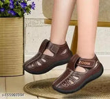 Brown synthetic leather casual sandals for kids, ideal for boys and girls, featuring Velcro fastening and PVC pattern for comfort and durability. Stylish design ensures a sturdy grip and relaxed fit. Kick Up brand