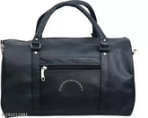 Black faux leather duffel bag for travel, regular capacity with 1 compartment and free size dimensions (18in x 12in x 3in). Indian-made travel bag on luggage stand