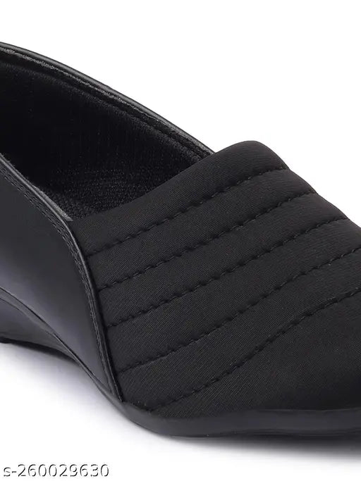 Black synthetic sneakers by Furiozz - Solid design with closed back, offering comfort and style for women