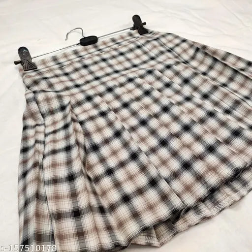 Pleated check skirts for women, polycotton with checked pattern, size 26, 28 or 30 on a clothing rack