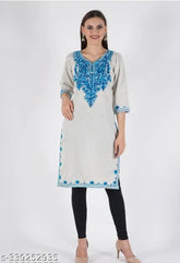 Fashionable woolen kurti with three-quarter sleeves, solid design. Handmade Aari work embroidery on Indian-made wool fabric. Perfect for chilly winter days. Size M (Bust 40", Length 42"), L (Bust 42", Length 42"), XL (Bust 44", Length 42")