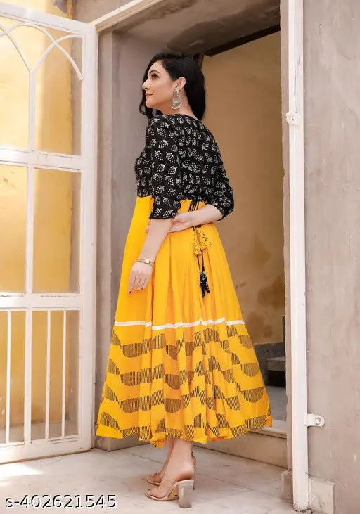 Yellow printed flared kurti, rayon, three-quarter sleeves, intricate Indian print on model