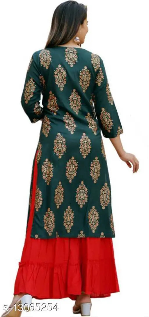 Green rayon printed kurta with red sharara set, three-quarter sleeves, pom-2 detail - Indian fashion on model