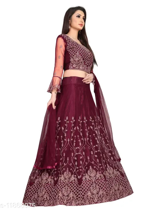 Maroon embroidered nylon net wedding lehenga set with unstitched blouse - intricate Indian embellishments on flared design