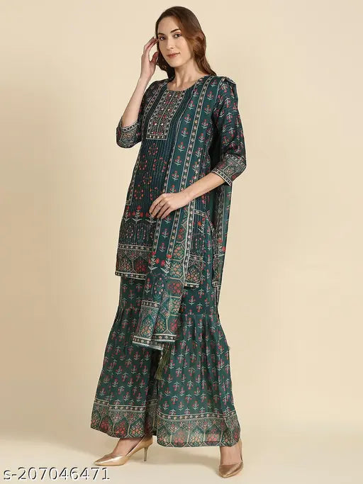 Green and blue printed Maslin boat neck kurta sharara set with chrochit work and dupatta, featuring puff sleeves and handwork. Ideal for parties and festivals. Made from Kora Muslin and Chanderi Silk. Indian ethnic wear