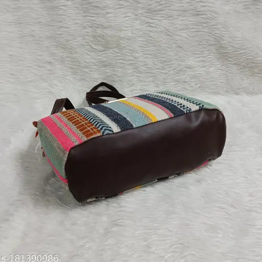 Classical applique design jute women's ethnic sling bag, free size with 3 compartments. Trendy hand block prints, sturdy grip, adjustable long belt. Perfect for daily use with western or traditional outfits." (120 characters)