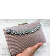 Synthetic textured net, compact bridal clutch. Elegant accessory for modern women, featuring secure closure, intricate detailing, and versatile use