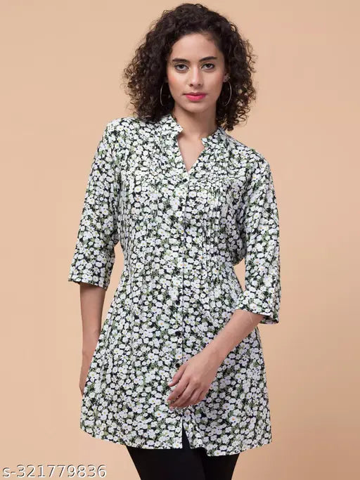 Rayon green flower tunic with front pleats, waist string, and 3/4 sleeves, Mandarin collar on display