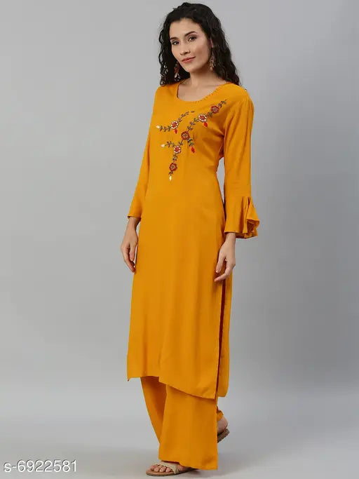 Women's rayon solid long kurti with palazzos, vibrant Indian fashion outfit on model
