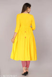 Yellow Rayon Anarkali Kurta with embroidered detail, three-quarter sleeves. Indian women's fashion, contemporary look