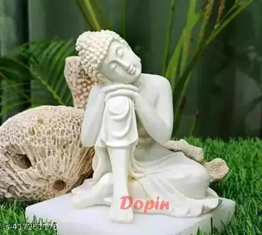 White resin Thinking Buddha statue, 10cm x 10cm x 12.5cm, ideal for home decor and gifting during Diwali, Christmas, or any festival. Handcrafted piece radiating peace and harmony