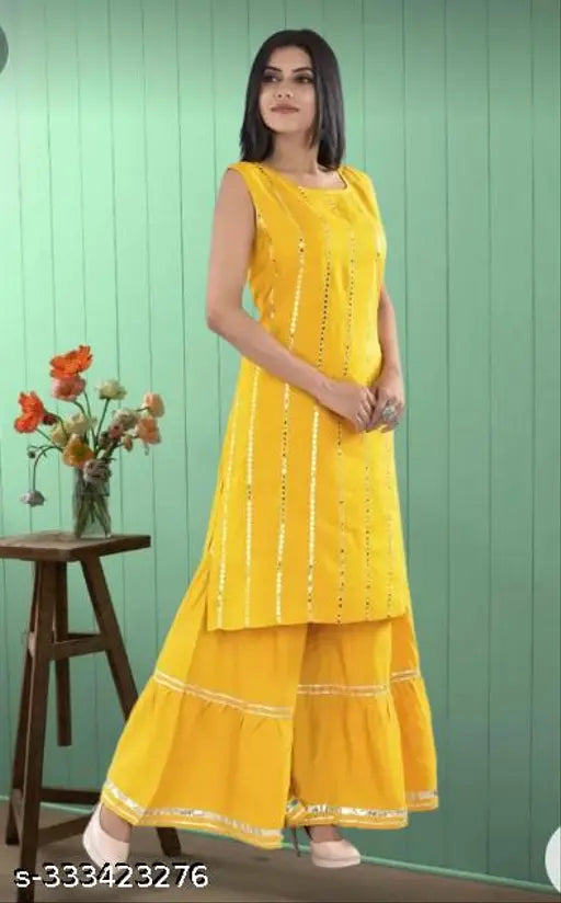 Striped rayon kurta set with sharara bottomwear in yellow color, three-quarter sleeve length. Indian fashion wear for women in various sizes (S-XXXL)