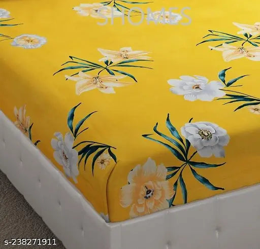 Yellow cotton elastic fitted double bedsheet, king size with two pillow covers. All-round elasticated edges ensure a secure fit for comfortable sleep. Ideal for standard king-size double beds (72x78x8 inches). Made in India