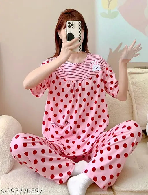Imported cotton blend nightsuit with printed net pattern, short-sleeved t-shirt style top and pyjama bottoms. (M: Top bust 38in, top length 24in, bottom waist 36in, bottom length 36in; L: Top bust 40in, top length 24in, bottom waist 36in, bottom length 36in) Made in India