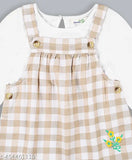 Light brown checkered dungaree with full-sleeve t-shirt: Kids' Indian cotton blend checkered dungaree with adjustable strap, paired with soft hosiery cotton t-shirt