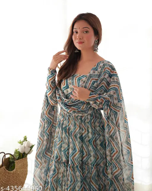 Light blue and light yellow Anarkali set: Heavy soft viscose straight fit Kurta with dupatta, featuring zigzag print and padded full churidar sleeves. Lace work, flair gown, microscrape lining, shawl style dupatta, and silk pent fabric." (125 characters)