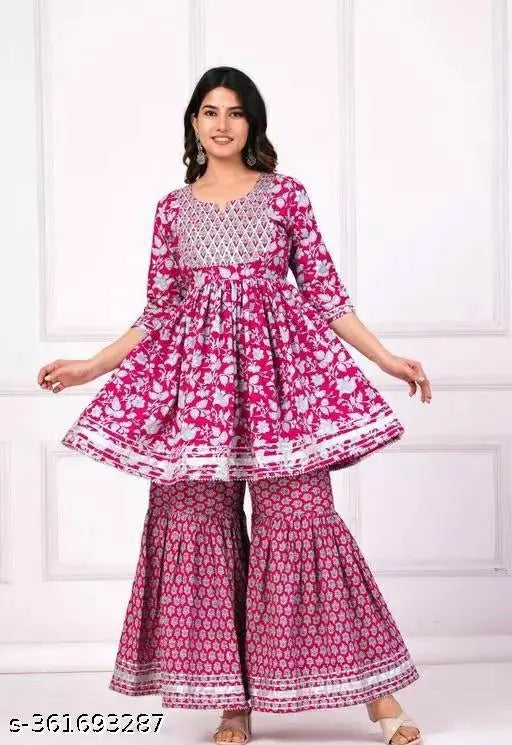 Women's pink sharara set with dupatta and bottomwear, rayon fabric, printed net, three-quarter sleeves on mannequin