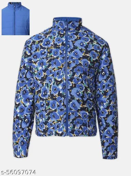 Blue polyester girls jacket with floral print and reversible quilted design, long sleeves, standing collar, and zip. Perfect for a vibrant, tailored look. Ideal for ages 5-14 years. Made in India