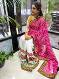 Half and half bandhani pallu Kutchi embroidered saree on mannequin, Indian party wear in kora muslin and embellished net