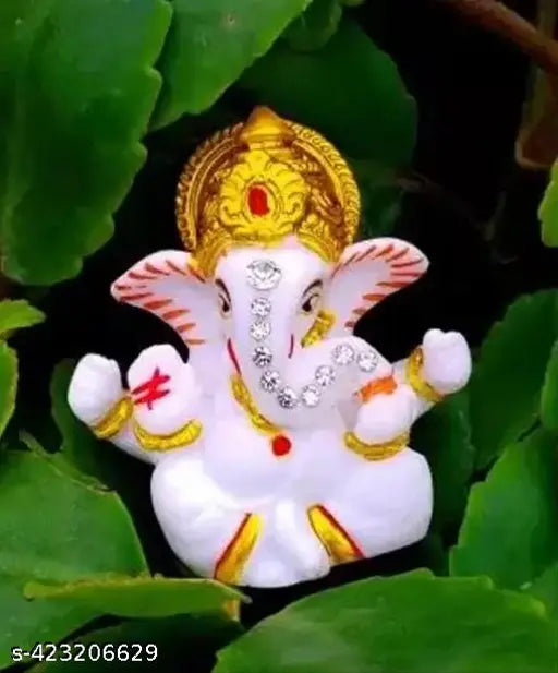Handcrafted Lord Ganesha idol for home decor and car dashboard. Made by Ram Lalla Handicraft, suitable for gifts and religious festive decor. Double-sided tape included for easy placement (LxWxH: 2 x 1 x 6.5 cm)