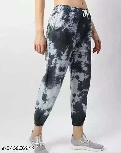Multicolor dyed, polyester trackpants for women's active bottomwear, soft French Terry fabric with elasticity, breathable cotton lining, colorblocked pattern, adjustable fit, and elastic cuffs, hand/machine washable, quality checked, Indian origin