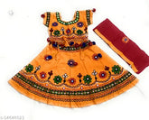 Yellow cotton printed designer Lehenga Choli set for baby girls, featuring short sleeves and ethnic motif. Made in heavy fabric, perfect for functions, festivals, parties, or weddings. Handcrafted in India