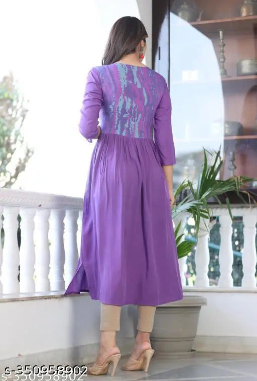 Purple tie-dye rayon kurti with embroidered yoke, single print pattern. Three-quarter sleeves, S-XXXL sizes available. Indian traditional women's clothing on display
