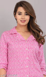 Pink cotton printed women's night suit set, loose-fitting pyjamas with 3/4 sleeves, floral print on breathable cotton fabric, ideal for lounging or sleeping, made by Pragya Textile, India origin