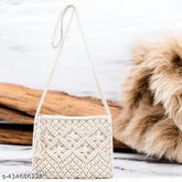 Handcrafted boho-chic macrame sling bag, intricate knots, fringe detailing. 100% natural cotton, perfect for everyday use or festival style. Made in India