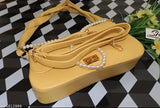 Light yellow synthetic slingbag with removable straps, offering spacious storage for daily essentials. Premium quality F1 design, perfect for everyday fashion