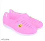 Pink plastic slip-on ballerinas, solid pink belly CH on shoe rack, India-made ballet flats