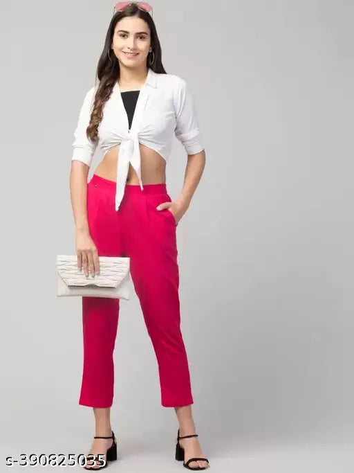 Women's pink cotton blend regular fit trousers, solid color, size S-XXL on display rack