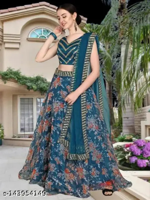 Embroidered satin & net lehenga-choli (Rama), floral and chevron patterns. Semi-stitched Indian bridal wear on mannequin