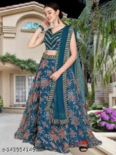 Embroidered satin & net lehenga-choli (Rama), floral and chevron patterns. Semi-stitched Indian bridal wear on mannequin