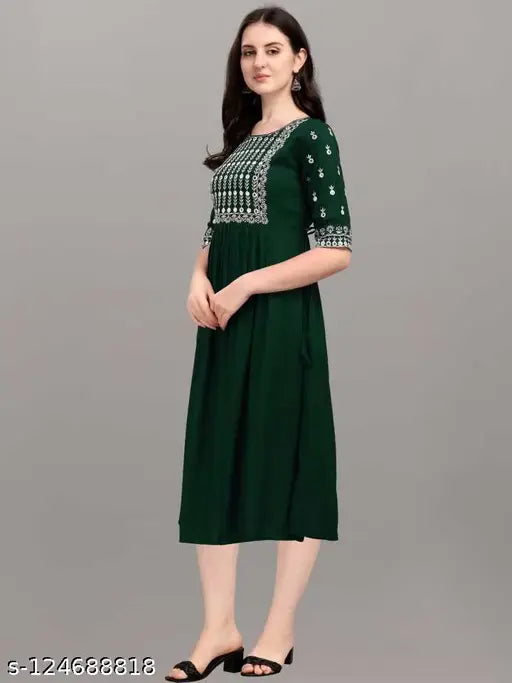 Green rayon embroidery kurti with three-quarter sleeves, 14 kg. Rayon fabric and intricate embroidery work on a traditional Indian design