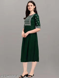 Green rayon embroidery kurti with three-quarter sleeves, 14 kg. Rayon fabric and intricate embroidery work on a traditional Indian design